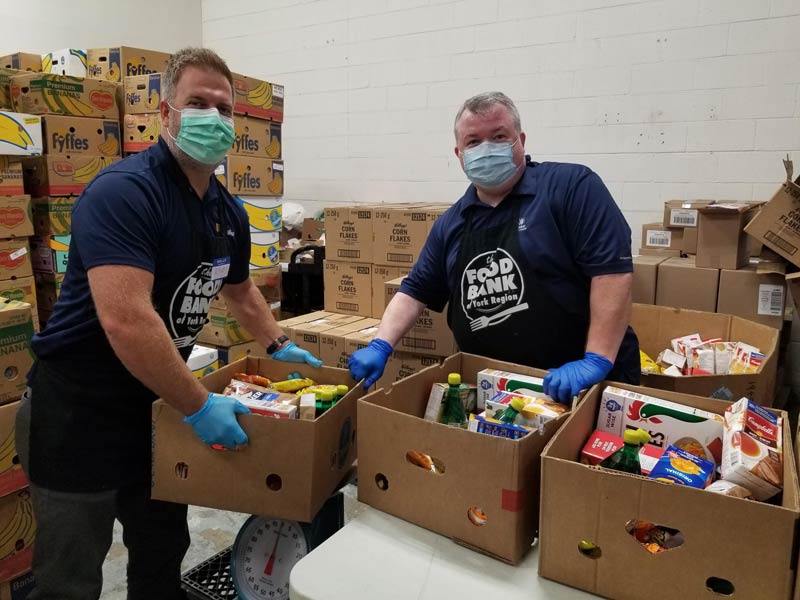 employees packing food for food bank